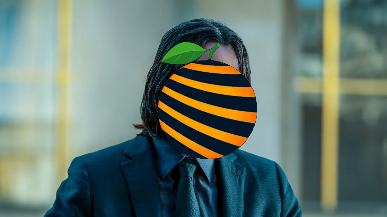 John Wick with an orange for a face, the Wingman guide cover.